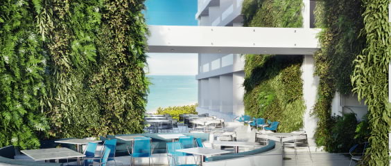 A striking hotel courtyard by a tropical beach